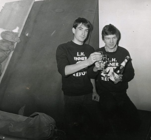 John and Andrew enjoy champagne after their stay in the shelter