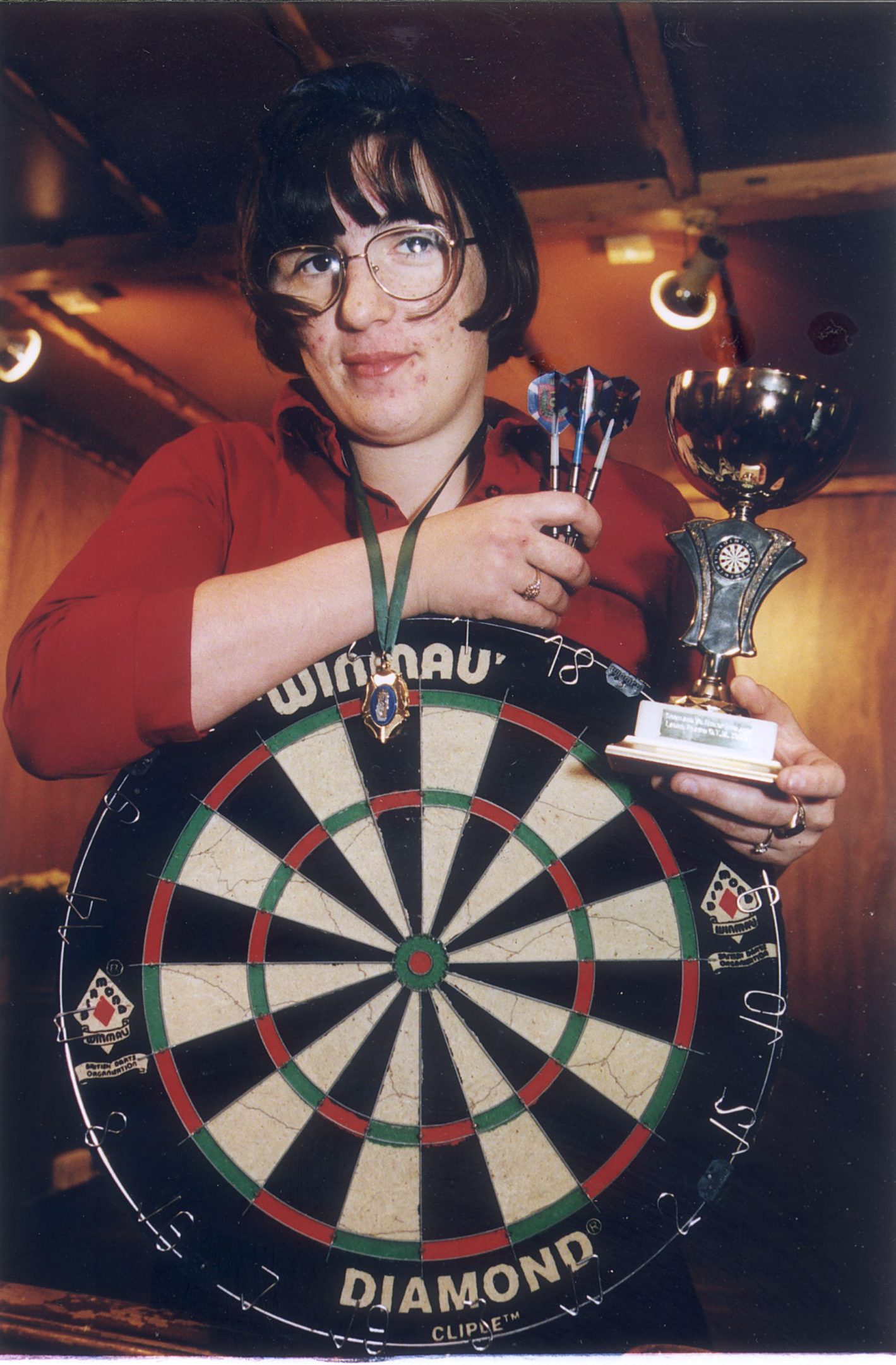 Kerry Soutar holds a dart board as she shows off her trophies in 1999.