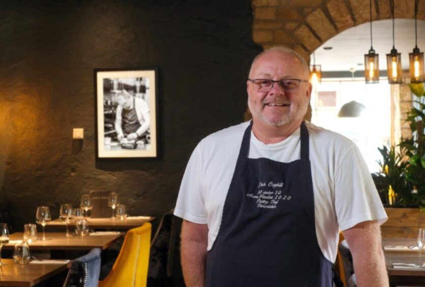 Bryan Coghill in his navy and white striped chef's apron in his restaurant in Dunfermline.