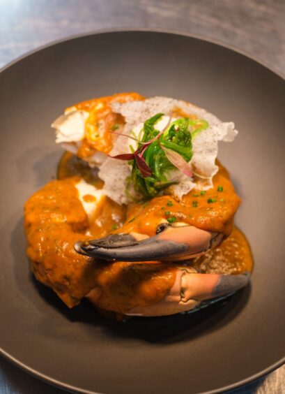 Singapore Crab Tempura - Softshell crab, Singapore sauce, pickled peppers on a grey granite plate. 