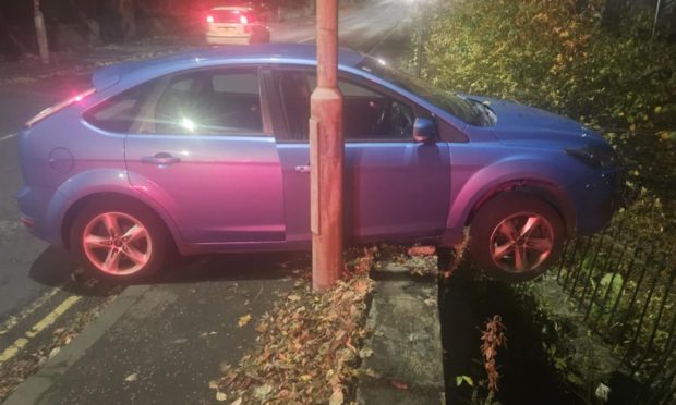 One of the cars crashed into railings at Dudhope Park. Image: Supplied