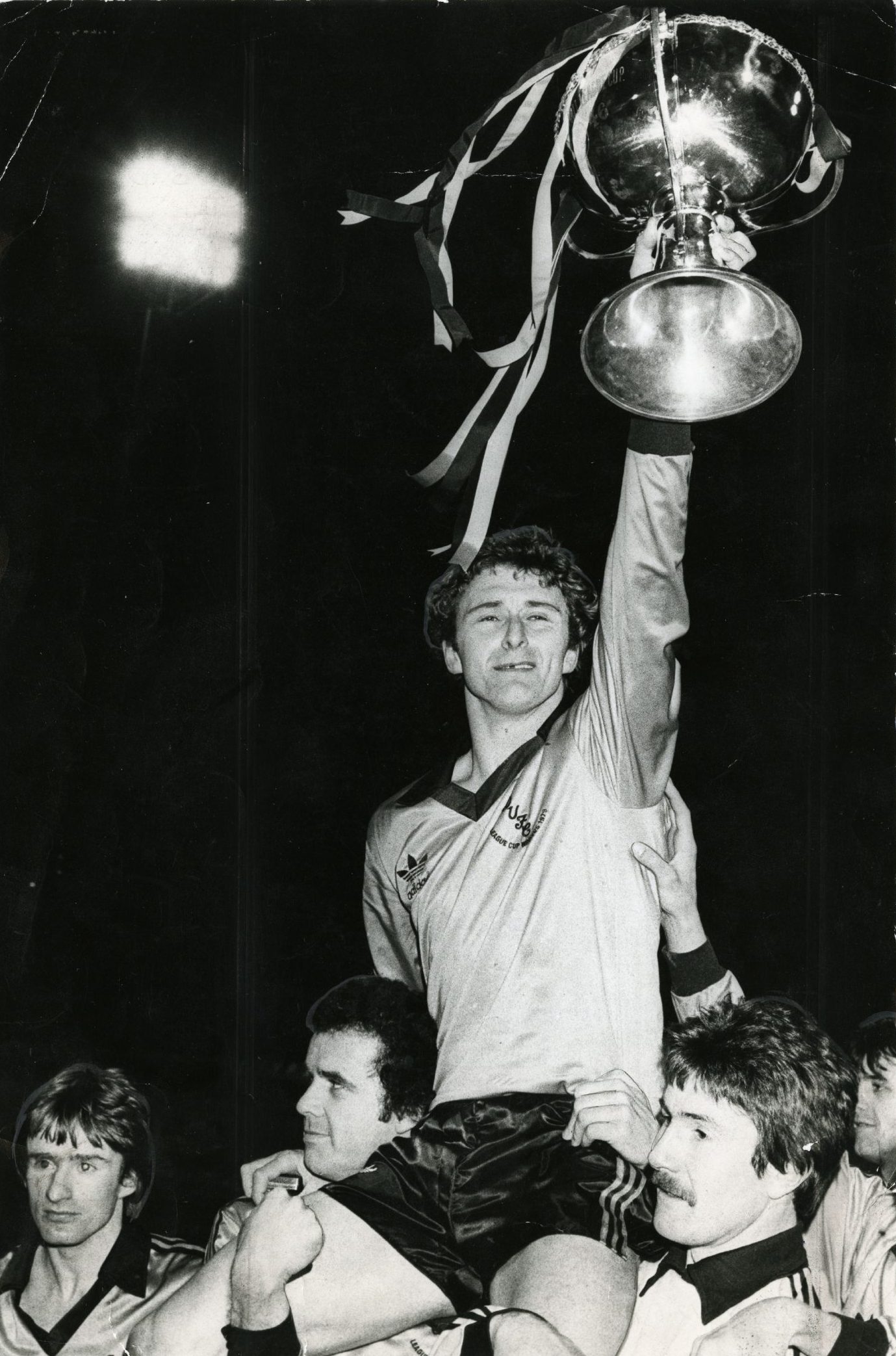 Hegarty on his team-mates' shoulders with the League Cup on the pitch at Dens Park in 1980. 