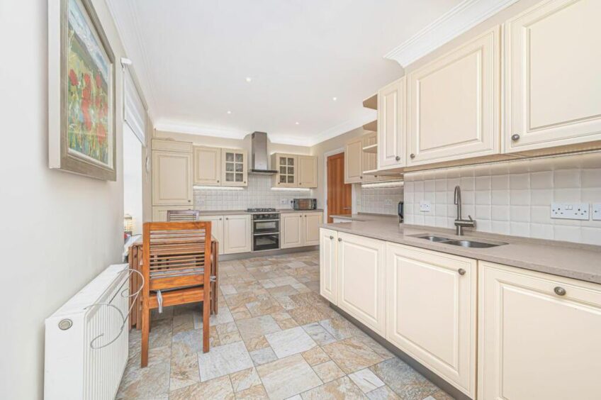 The kitchen features modern appliances. 