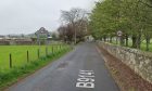 A section of road coming into Dunning with signs that welcome to Dunning.