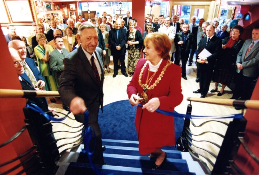 Lord Provost Helen Wright cutting the ribbon at the foot of some stairs in August 1999.