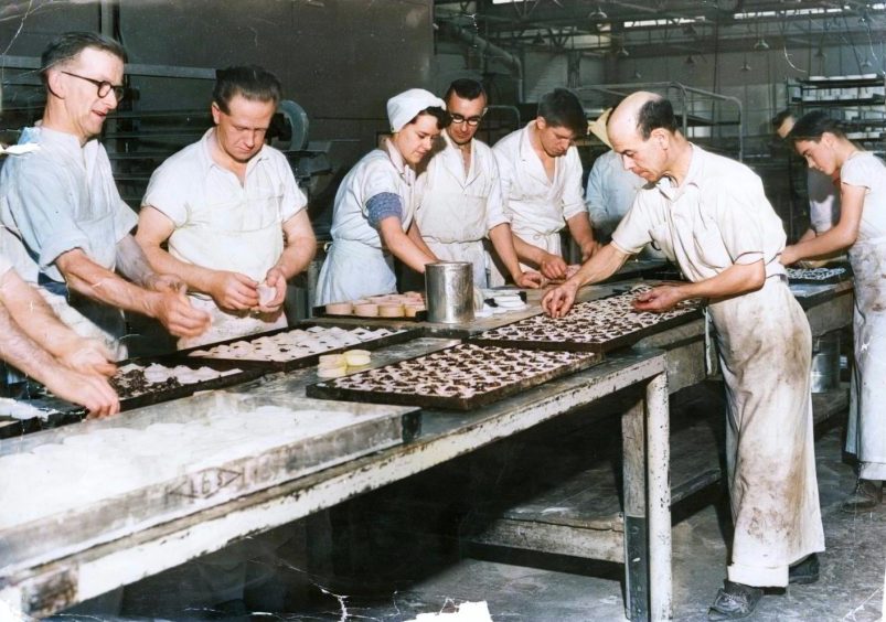 Workers filling the Christmas pies on the production line at Beattie's bakery in 1956.