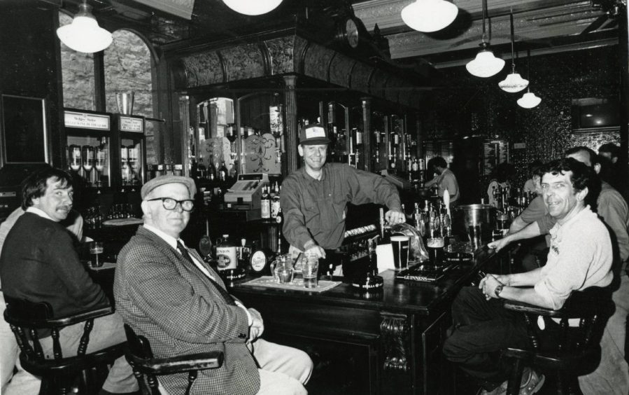 Allan Bannerman alongside his customers in the Phoenix Bar in July 1987.