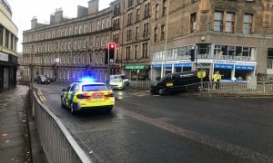 The van crashed near several shops. Image: James Simpson/DC Thomson