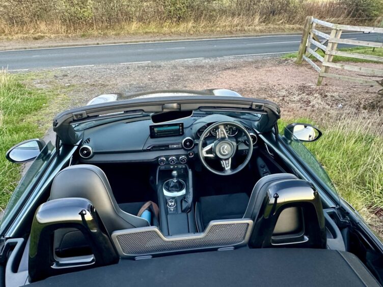 a picture showing the front two seats and dashboard from above