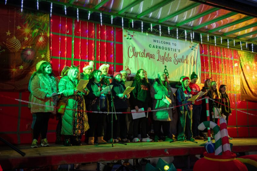 Choir singing at Carnoustie Christmas lights switch-on.