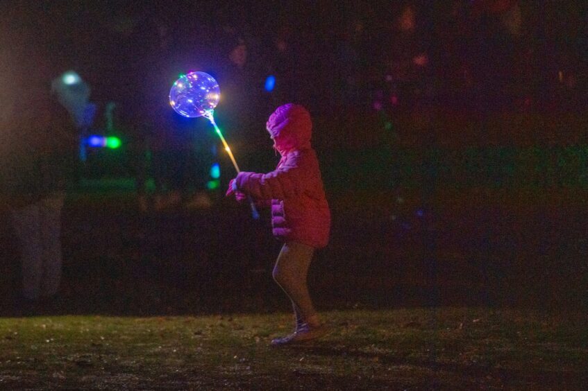 Making her own light display at Cupar fireworks.