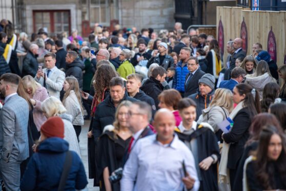 Crowds outside the Caird Hall, City Square, Dundee, in November for Dundee University's winter graduations. Image: Kim Cessford / DC Thomson