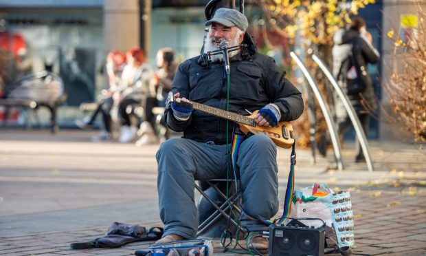 Eric Gudmunsen is a popular busker in Dundee city centre. Image: Kim Cessford / DC Thomson