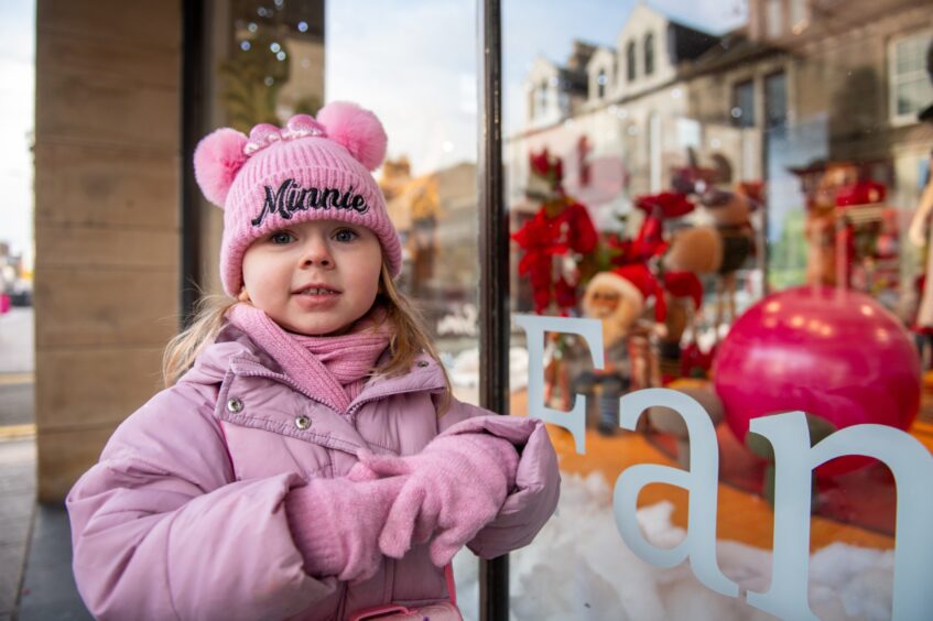 Aria Philip, 3, delighted by the window display.