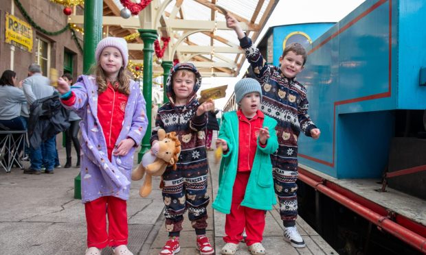 Lexi Work, Finlay Kidd, Teddy Work and Ramsay Kidd ready to board The Polar Express. Image: Kim Cessford / DC Thomson