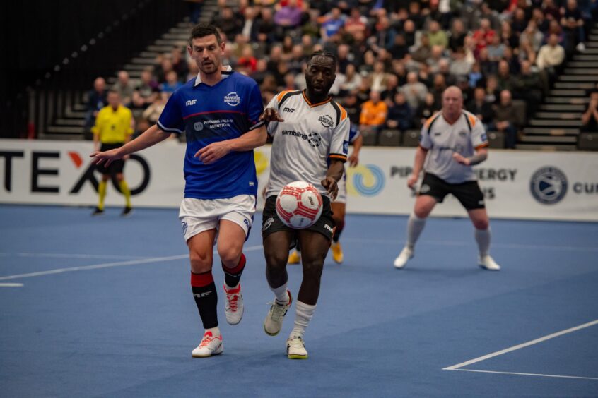 The excellent Gomis does battle with former Dundee man Graham Dorrans, representing Rangers