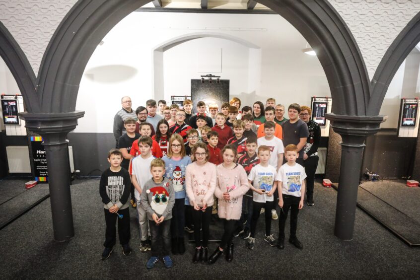 Angus Darts Academy competition competitors in a group picture