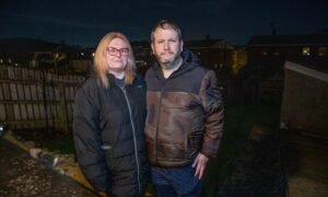 Vicky and Arthur Frater in their garden in the dark