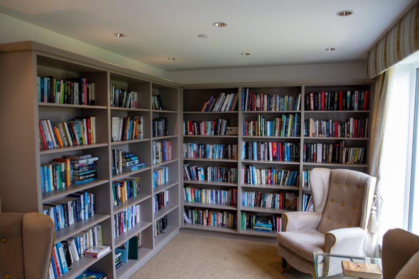 The Dalgety Bay Care Home library has several comfortable seats.