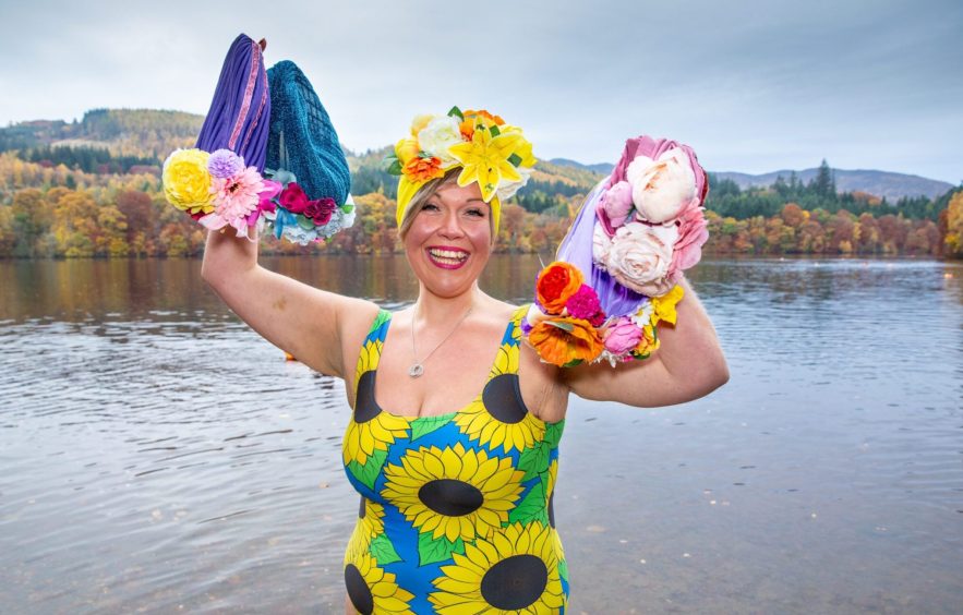 IMage shows: swim hat designer Stephanie Scott with a selection of brightly coloured and decorated swimming caps.