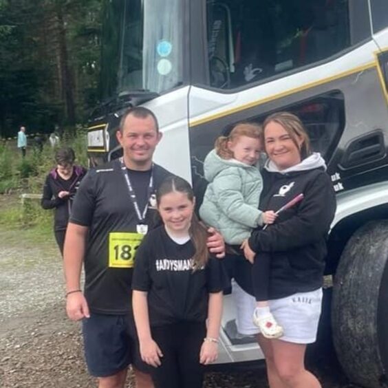 Kenny pictured with wife Amy and their daughters Sophie and Ivy.