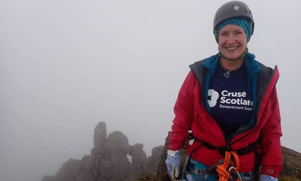 Mairi Morrison conquers a misty Munro on the way to completing her 65th birthday challenge. Image: Supplied