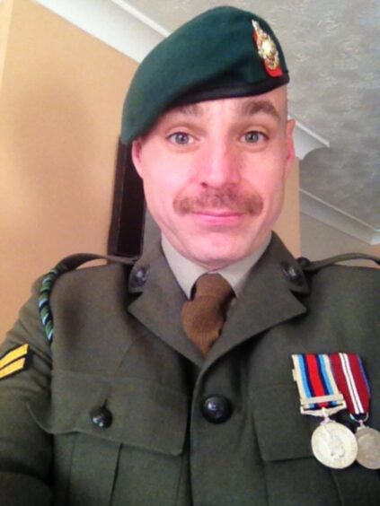 Mick, from Fife, served in the Royal Marines and is pictured taking a selfie in his uniform