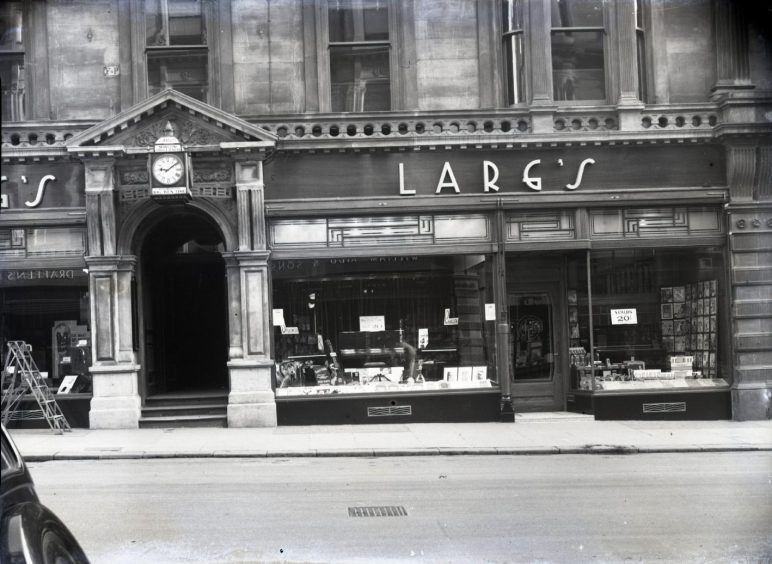 a black and white picture of the outside of Dundee record shop Larg's 