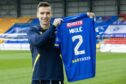 Bozo Mikulic holds his St Johnstone shirt after news of his work permit's completion. Image: Graeme Hart/PPA