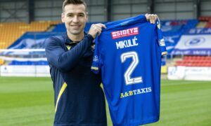 Bozo Mikulic holds his St Johnstone shirt after news of his work permit's completion. Image: Graeme Hart/PPA