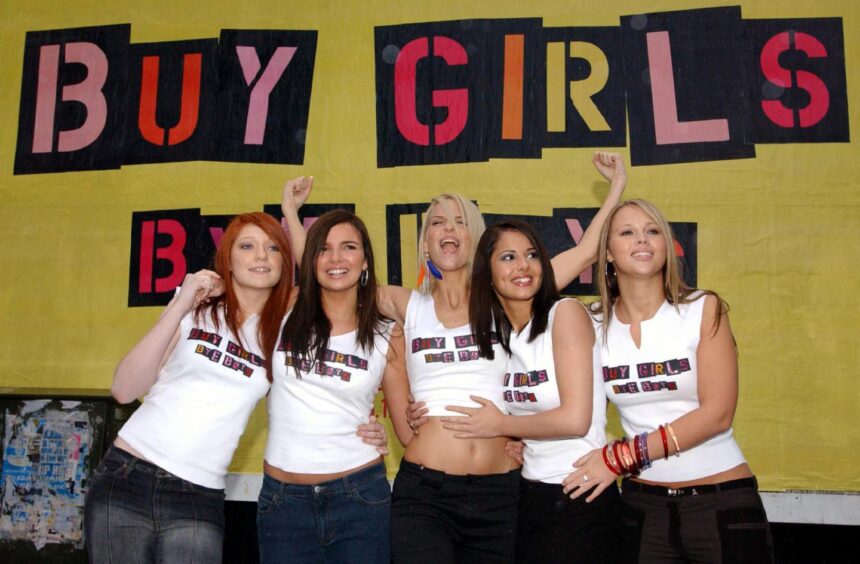 Girls Aloud pose for a picture after winning the competition in 2002