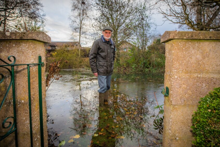 Jack Blair in his flooded Bridge of Earn garden.