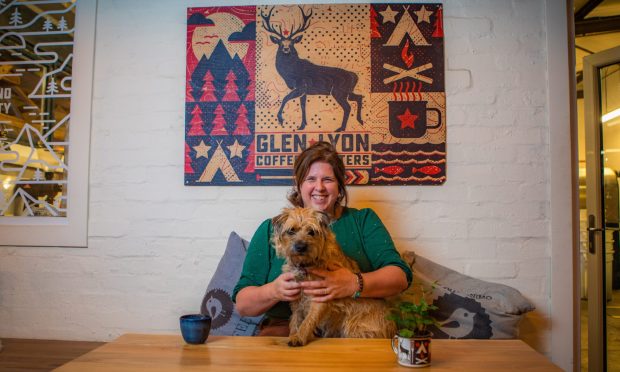 Glen Lyon Coffee Roasters owner Fiona Grant and her dog in her cosy café.