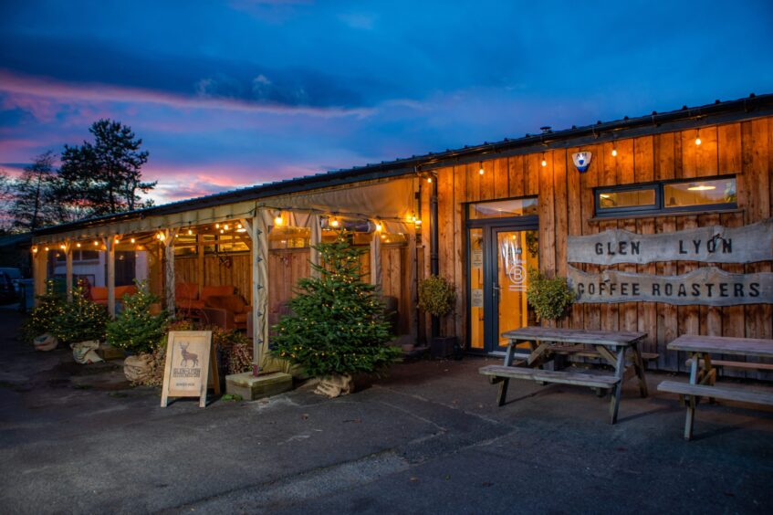 The outside of the Glen Lyon Café has been decorated with Christmas trees and fairy light.