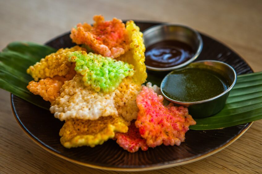 The colourful semolina crisps with a sweet dip and a chilli mint dip.