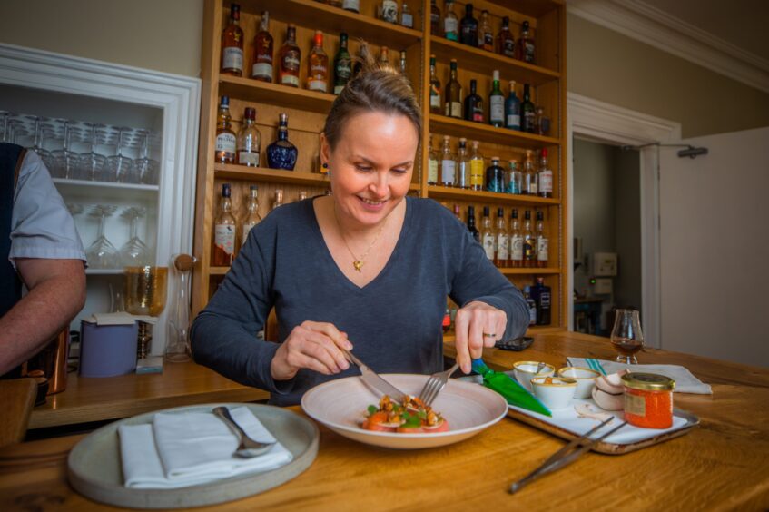 Rachel tucking into the beautiful rainbow trout dish.