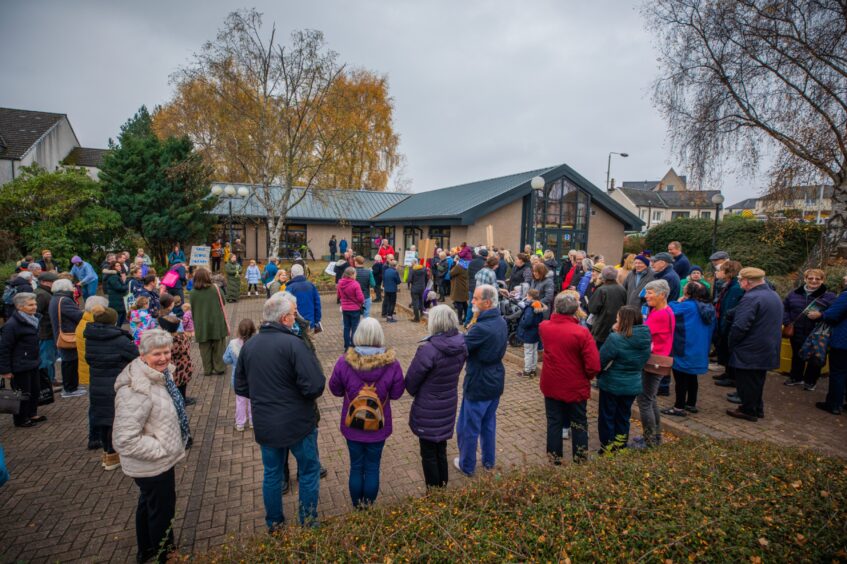 Large crowd of people outside Scone library