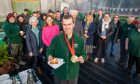 Paralympic champion Ben Sandilands shows off his golf medal - and his cake. Image: Steve Brown/DC Thomson