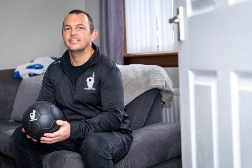 Kirkcaldy dad Kenny with a stress ball used at Andy's Man Club.