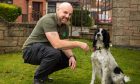 Fife Royal Marine veteran Mick Cairns with his dog Sam.