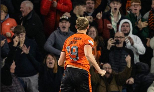 Sam Dalby sends the United fans at Easter Road wild with his nerveless penalty