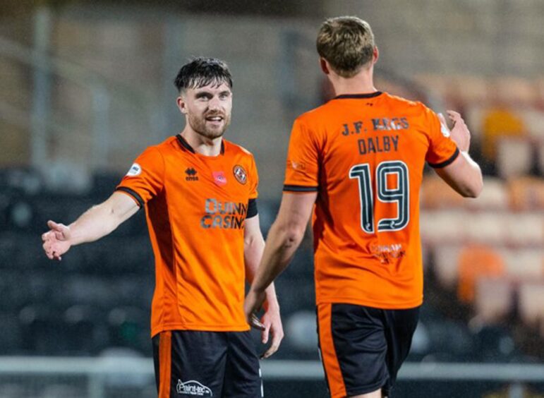 Ryan Strain, left, congratulates Sam Dalby