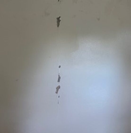 Damaged walls in the TV room. 