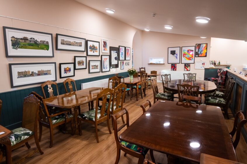 The elevated seating area at The Culdee has local artwork on the wall for sale.