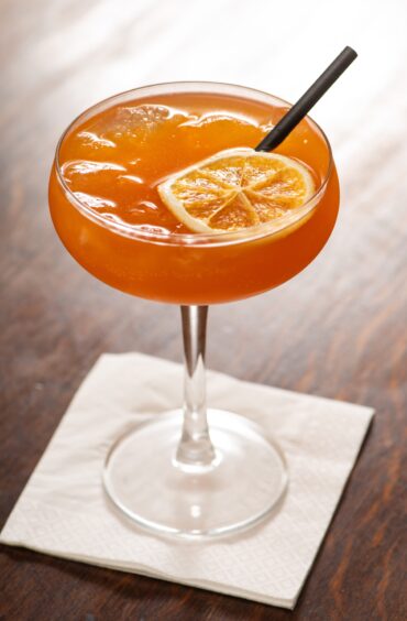  A bright orange mocktail.