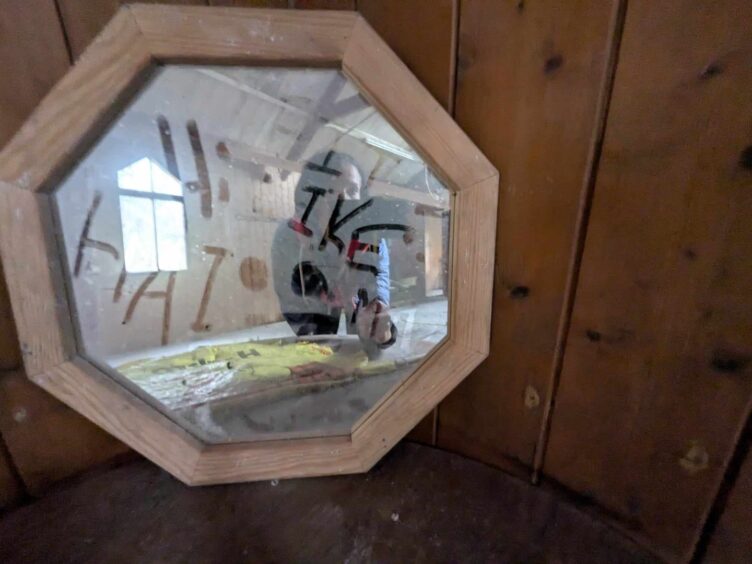 A dusty mirror inside the Tin Kirk. Image: Gayle Ritchie.