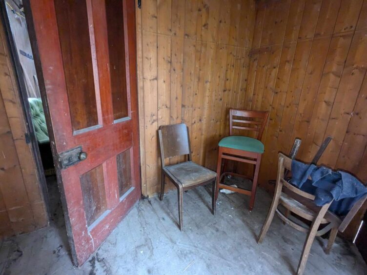 Old wooden chairs inside the Tin Kirk. Image: Gayle Ritchie.