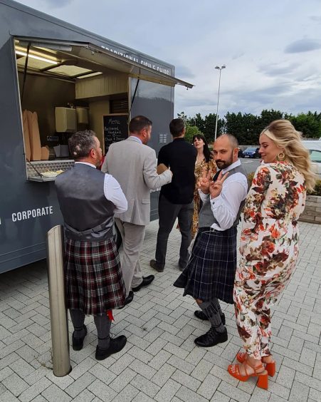 The Strathearn Food Company fish and chips van at a wedding, with guests queuing up for a supper.