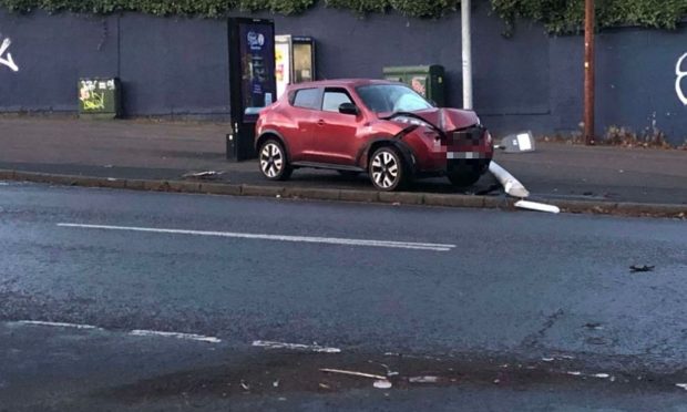 A vehicle struck a lamp-post near Dundee's Dens Park