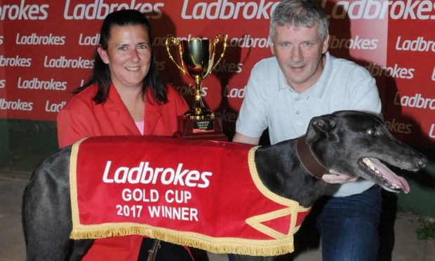 Angela Harrison and Jimmy Wright with one of their greyhounds.